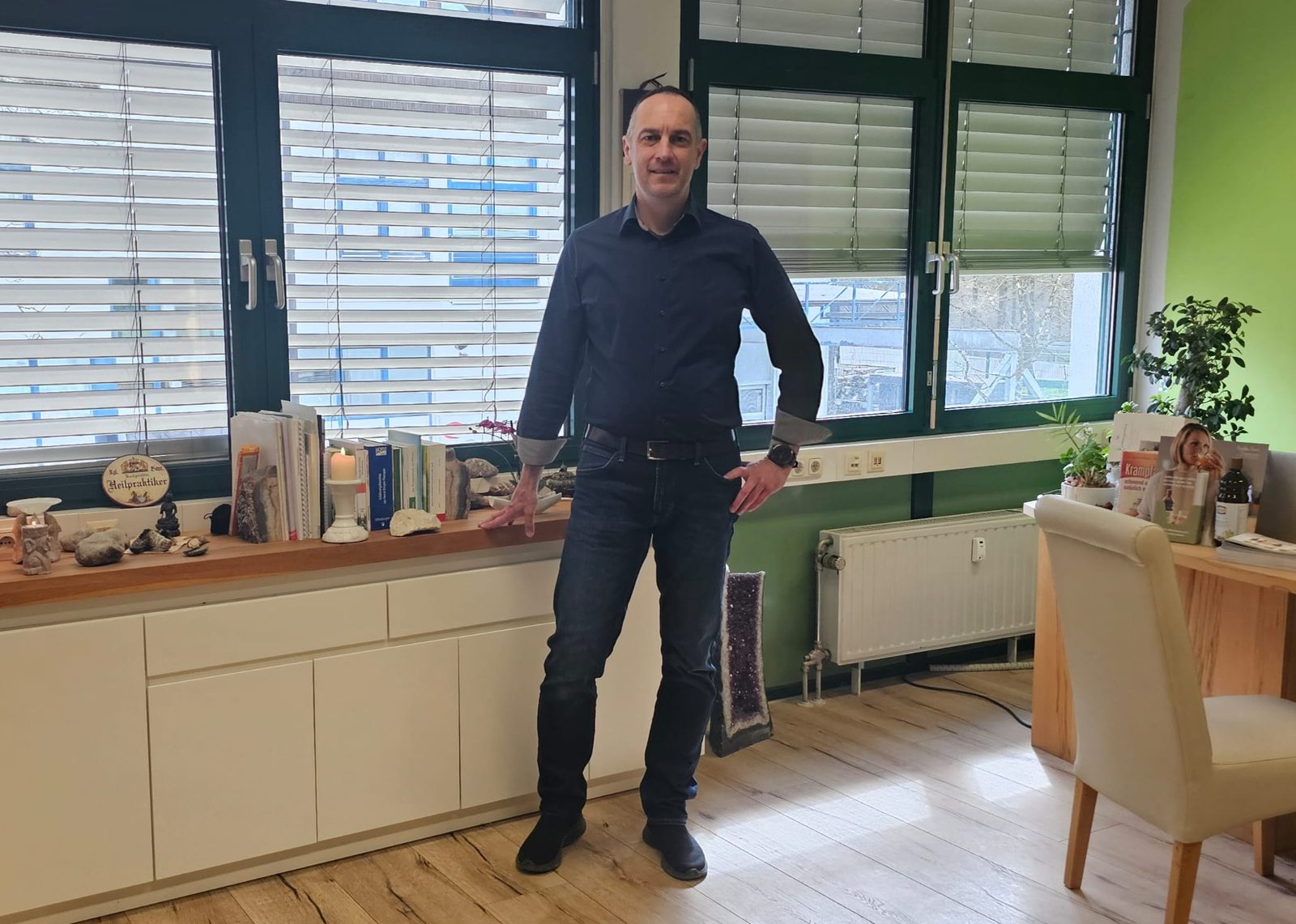 Egon Philipp in the bright reception area of the practice