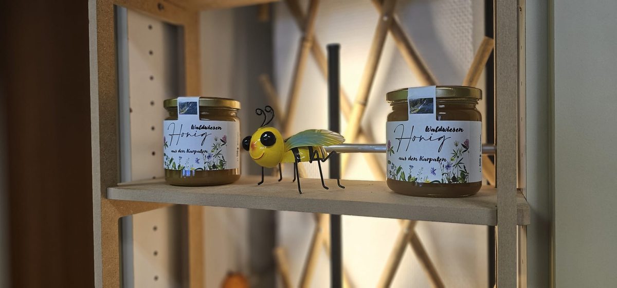 Jars of honey from the Carpathians on the practice shelf